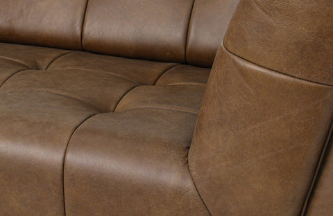 Close-up of a Top Full Aniline Leather Sofas showcasing luxurious brown leather texture.