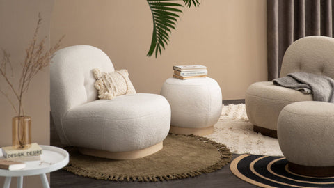 Why Furniture Is More Emotional Than You Think, cozy living room with modern chairs and round table.