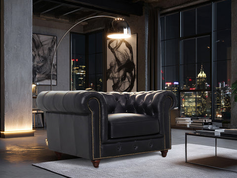 Stanhope Black Leather 1 Seater Chesterfield in modern living room with city skyline view.