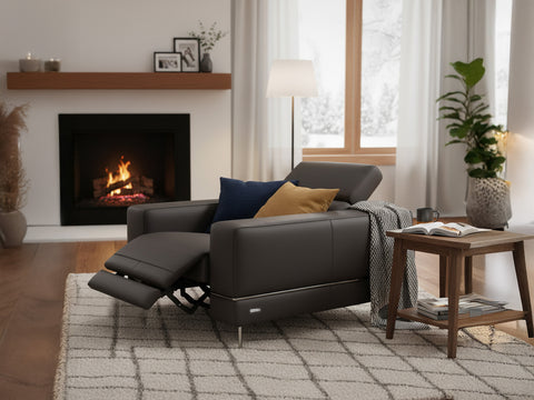 Modena Grey Leather Motorized Single Recliner in modern living room with fireplace.