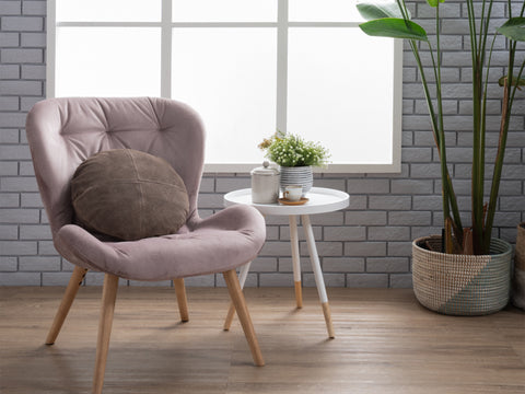 Camilla White Tripod Side Table with bentwood top and solid wood legs in modern room with chair and plants