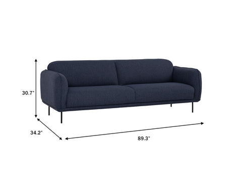 Livia Navy Blue 3 seater Extra Firm Sofa with dimensions 89.3" x 34.2" x 30.7", featuring sleek black metal legs.