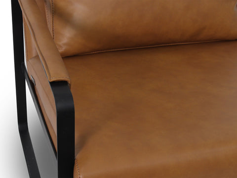 Luna Modern Leather Tan Accent Chair detail showing sleek tan leather upholstery and minimalist black frame.
