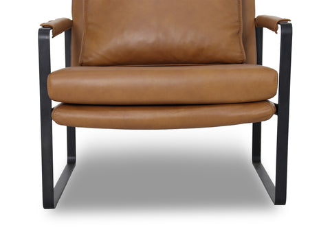 Luna Modern Leather Tan Accent Chair detail shot showing sleek tan leather upholstery and minimalist black frame.