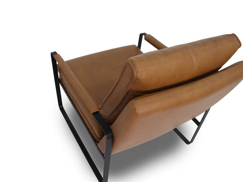 Luna Modern Leather Tan Accent Chair showcasing premium leather upholstery and sleek black metal frame.