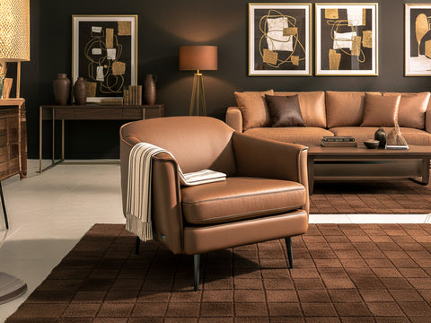 Lusso vintage Chestnut Brown leather accent chair in modern living room setting with complementary decor.
