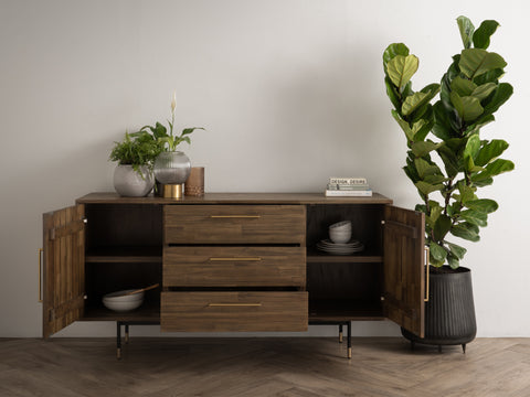 Nero Mid-Century Fluted Door Sideboard with Brass Handles featuring open doors and drawers, styled with plants and books.