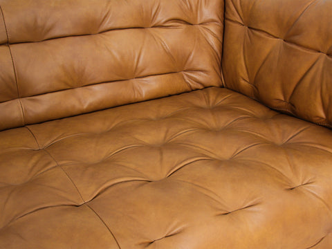 Close-up of the Nova Modern Chesterfield Tan Leather 3 Seater sofa, featuring rich tan leather and tufted detail.