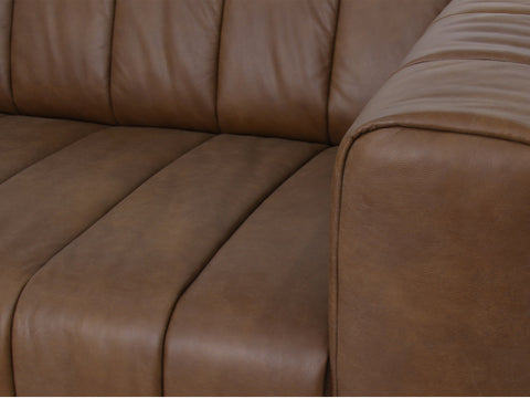 Close-up of the Portfino Vintage Brown Channel tufted leather sofa showcasing rich leather texture and channel tufting.