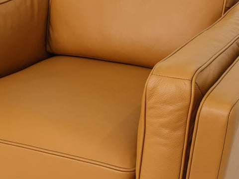 Selina Midcentury Cognac Leather Accent Chair close-up of luxurious cognac leather upholstery