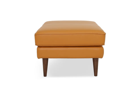 Selina Midcentury Cognac Leather Ottoman featuring a structured design and plush comfort with teak oak legs.