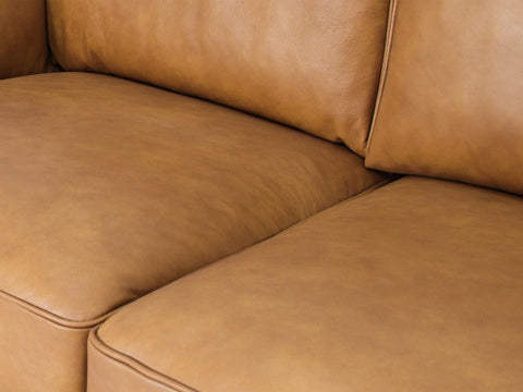 Selina Midcentury Tan Leather 3 Seater Sofa close-up of soft tan leather cushions and upholstery.