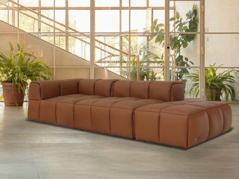 Tuscono Leather Brown 2 seater Single Lounge Modular Sofa in modern interior setting with plants.