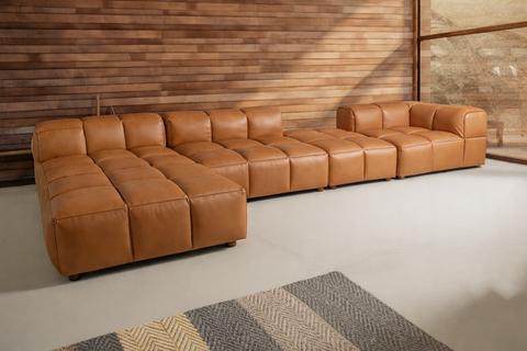 Luxurious Mid Century Modern Furniture leather sectional sofa in a stylish Toronto store showroom.