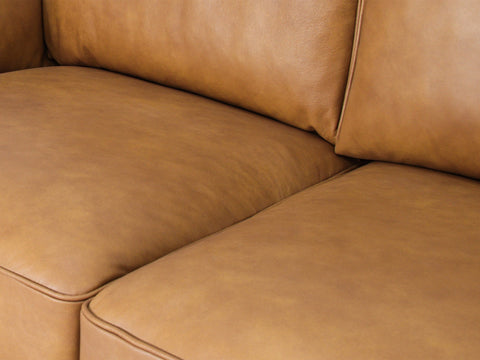 Close-up of a brown sofa to illustrate How to Tell If a Leather Sofa Is Real Leather.
