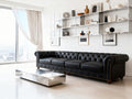 Stanhope Black 4 Seater Chesterfield sofa in modern living room with elegant decor.