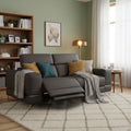 Modena Grey Leather Motorized Loveseat Recliner in modern living room setting with cozy cushions and natural lighting.