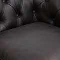 Close-up of Stanhope Black 3 Seater Chesterfield in top-grain leather showing button-tufted detail emphasizing luxury design.