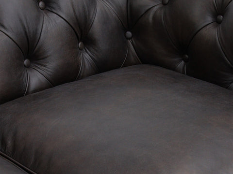 Close-up of Stanhope Black 3 Seater Chesterfield in top-grain leather showing button-tufted detail emphasizing luxury design.