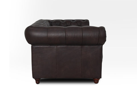 Side view of Stanhope Dark Chocolate Loveseat Chesterfield showing rich aniline leather upholstery and classic Chesterfield design.