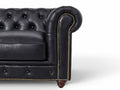 Close-up of Stanhope Black 3 Seater Chesterfield arm with black leather and studded detailing.