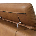 Close-up of headrest detail on Milano Tan Leather Sectional Sofa - Right Chaise, showcasing high-quality leather and modern design.