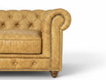 Close-up of Stanhope Camel Brown Distressed Leather 4 Seater Chesterfield with nailhead trim and tufted back
