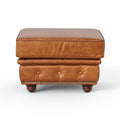 Front view of the Stanhope Cognac Distressed Leather Chesterfield Ottoman showcasing luxurious top-grain leather and button detailing.