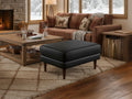 Selina Midcentury Black Leather Ottoman in cozy living room setting