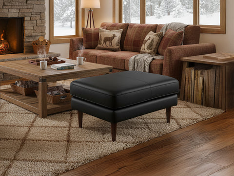 Selina Midcentury Black Leather Ottoman in cozy living room setting