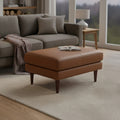Selina Midcentury Tan Leather Ottoman in stylish living room setting, showcasing premium leather and elegant design.