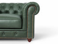 Close-up of the Stanhope Royal Green Leather 4 Seater Chesterfield showing tufted design and brass nailhead trim.