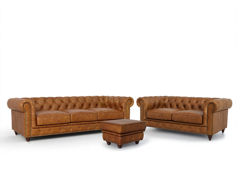 Stanhope Cognac Distressed Leather 3 Seater Chesterfield with matching ottoman, embodying British heritage and modern luxury.