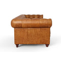 Side view of Stanhope Cognac Distressed Leather Loveseat Chesterfield with tufted back and top-grain leather upholstery.