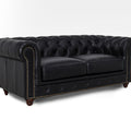 Stanhope Black Loveseat Chesterfield in top-grain leather with tufted back and brass nailhead trim.