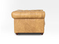 Side view of Stanhope Camel Brown Distressed Leather 1 Seater Chesterfield showing rich top-grain aniline leather texture.