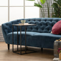 Amico Minimalist C-Shaped Laptop Table by blue sofa in modern living room with plants and decor