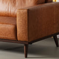 Amore Cognac Distressed Leather 3 seater sofa with teak legs, showcasing rich full-aniline leather and modern craftsmanship.