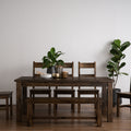 Annata Rustic Dining Chairs - Dark Solid Wood set of 2 with a dining table, featuring a rustic ladder back design and minimalist charm.
