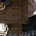 Annata Rustic Dining Table - Dark Solid Wood shown with open book and cozy setting