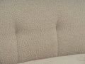Close-up of the Bianca Beige Boucle accent chair with ottoman showing textured boucle fabric for a cozy feel.