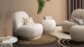 Bianca Boucle accent chair with ottoman in cozy modern living room setting.