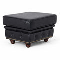 Stanhope Black Leather Chesterfield Ottoman with button tufting and wooden legs, showcasing British refinement and luxury.