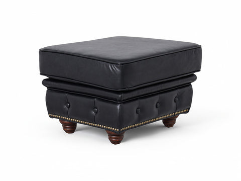 Stanhope Black Leather Chesterfield Ottoman with button tufting and wooden legs, showcasing British refinement and luxury.