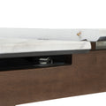 Close-up of Caldo Extendable dining table showing marble-look top and extension mechanism.