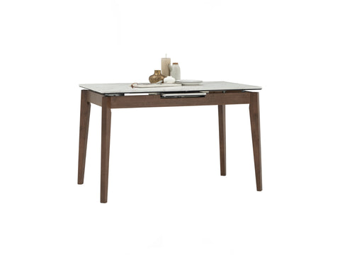 Caldo Extendable dining table with white marble-look top and cocoa-colored oak legs, featuring a built-in extension.