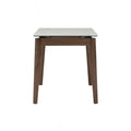 Caldo Extendable dining table with white marble-look top and cocoa-colored oak legs, designed for modern dining spaces.