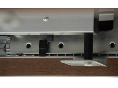 Close-up of the mechanism for the Caldo Extendable dining table's extension feature.