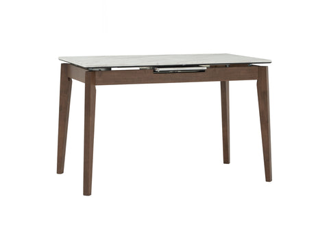 Caldo Extendable dining table with white marble-look top and cocoa oak legs, perfect for modern dining spaces.