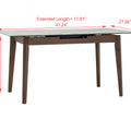 Caldo Extendable dining table with white marble-look top and cocoa-colored oak legs, showing extension feature.